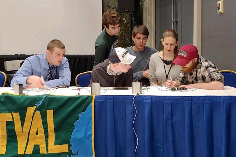 students conferring in geography bowl