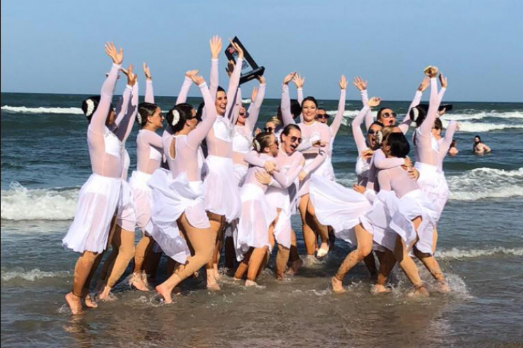 UNH's dance team by the ocean