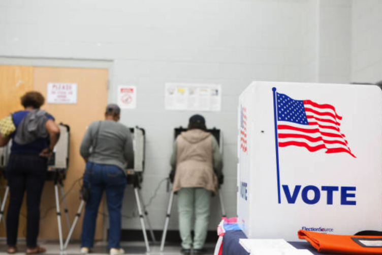 people lining up to vote at the voting center