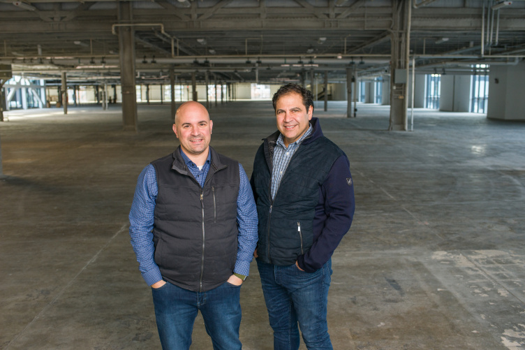 Mike Paglia and Dave Hallal in an empty warehouse