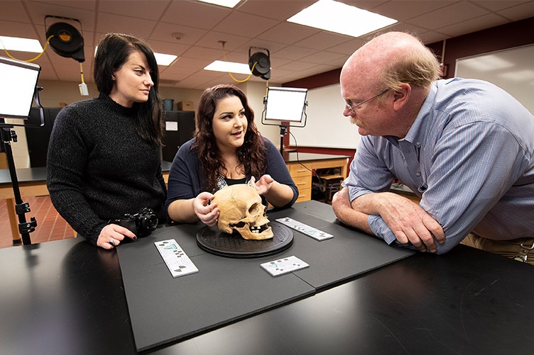 Katie Titus in archaelogy lab with Amy Michael and Greg McMahon