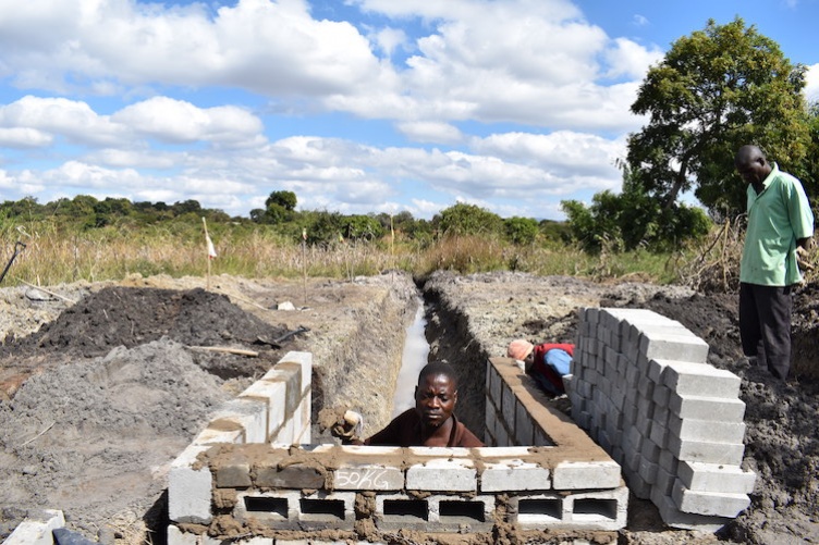 Trench leading from a spring to the wall where villagers can get water