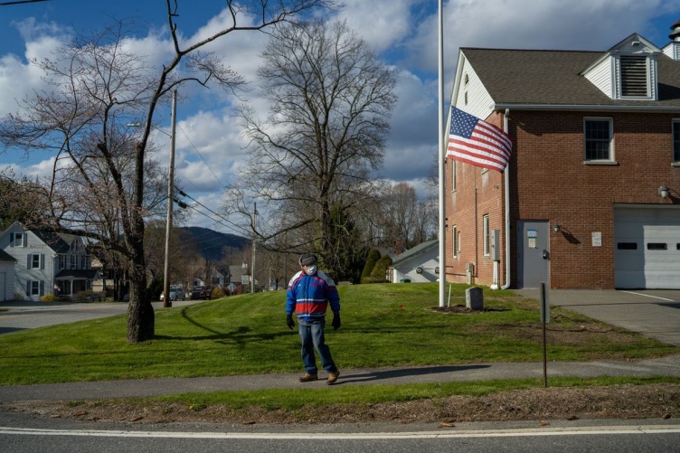 Person walking in a rural neighborhood Person walking in a rural neighborhood