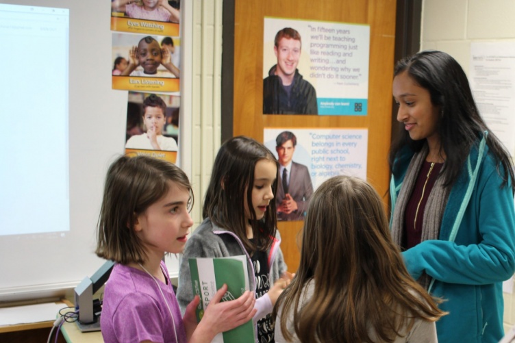 CodeIT Girls particpants gather around leader Meera Kurup.