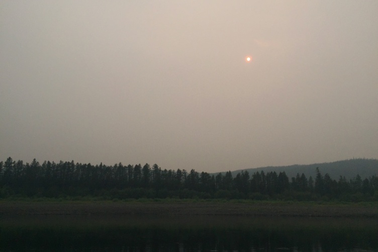 Hazy image of a landscape with faint sun 