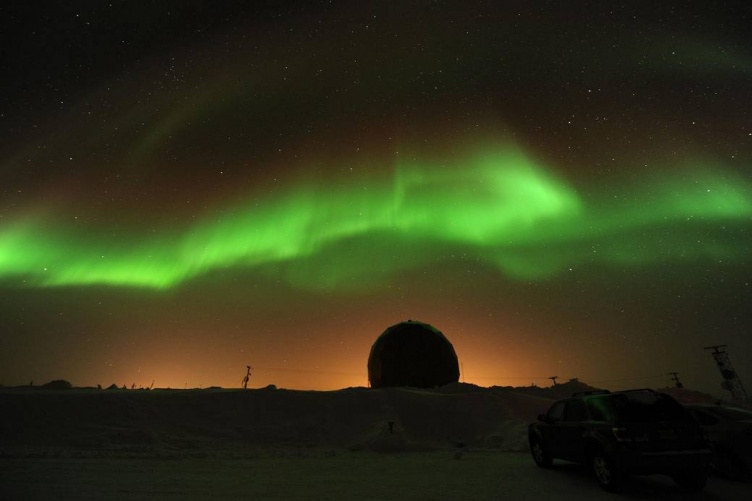 Northern Lights dance across the night sky