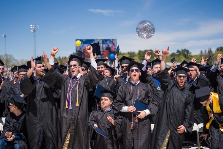 students in caps and gowns