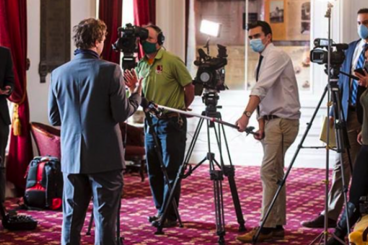 Sen. Tim Ashe answers questions from the media 