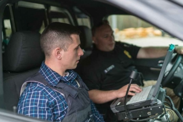 Psychology graduate Taylor Mitchell during a ride along with the Bow Police Department