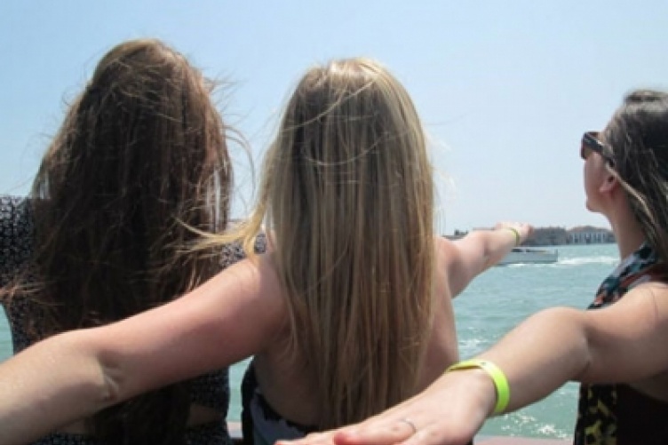 Three girls at a lake