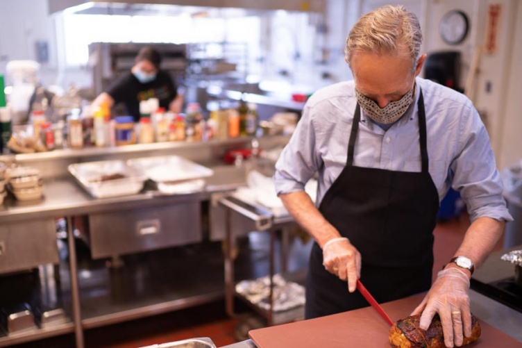 Dave Mortensen prepares meatloaf meals.