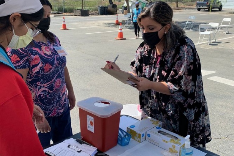 A California state senator visits an emergency medical care site in the state's Central Valley