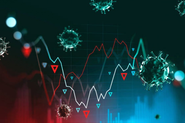 Image of a graph decreasing surrounded by pandemic related cells
