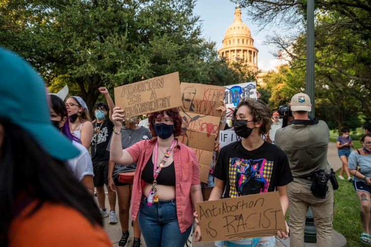 Image of people marching in women's rights movement 