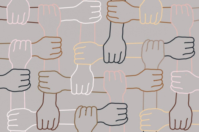 Image of arms connected to represent unison in diversity