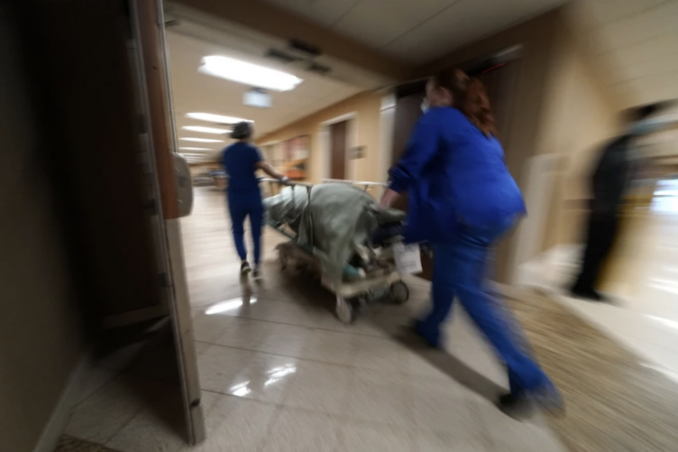 A photo showing emergency room workers helping a person.