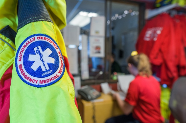 Close-up of McGregor EMS jacket with student working in background