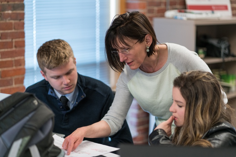 Computer science professor Mihaela Sabin works with UNH Manchester students