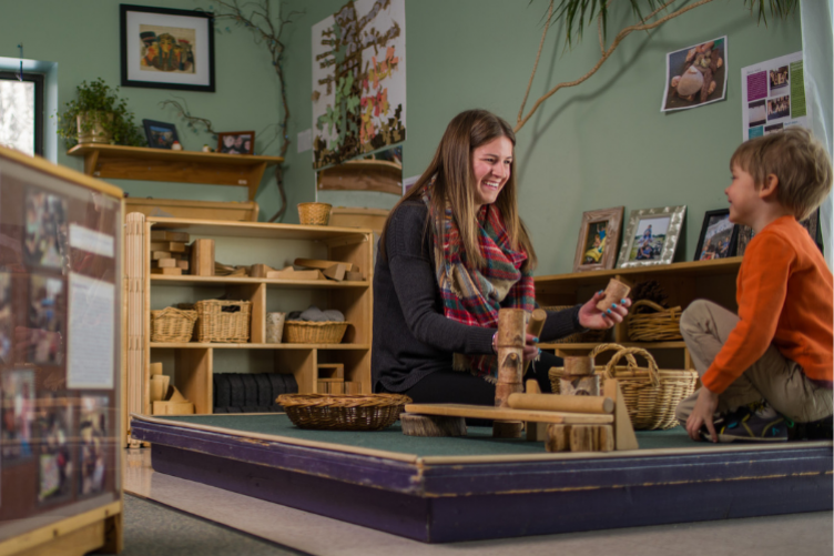 Student teacher playing with a child at the Child Study Development Center