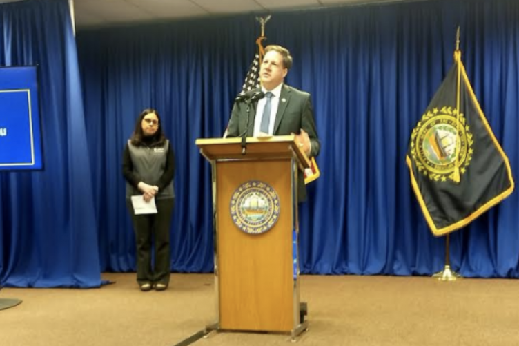 Governor Sununu speaks at a podium
