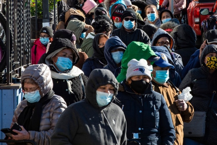 Image of people in line for food pantry in MA