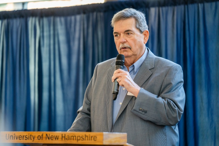 Bill Nyhan, one of the founders of eCoast Angels Investment Network accepts the UNH Entrepreneur of the Year Award