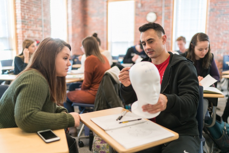 Neuropsychology students at UNH Manchester studying brain anatomy in psychobiology class