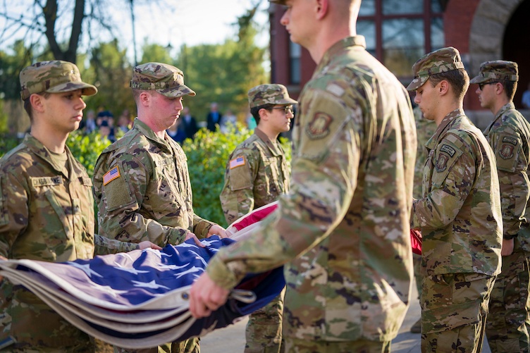 UNH ROTC students folding American flag