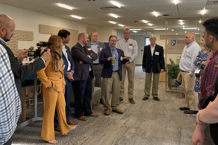 Synectics COO Jeff Spears speaks with people at the UNH Center for Business Analytics Synectics COO Jeff Spears speaks with people at the UNH Center for Business Analytics