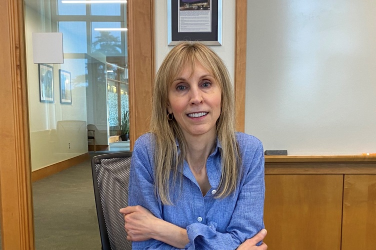 Sherri Cannon sits at a conference table at Paul College.