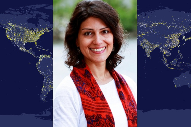 a photo of melinda Negron-Gonzales who is wearing a red scarf. In the background is a map of the world with a blue background showing countries