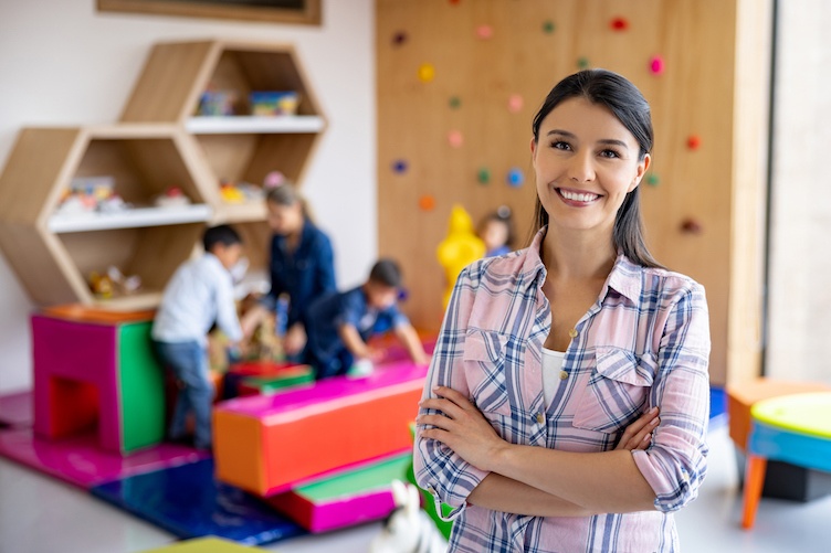 Teacher in preschool classroom.