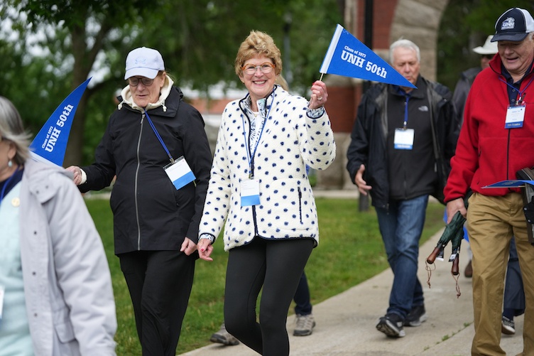 Alumni walking on campus during reunion