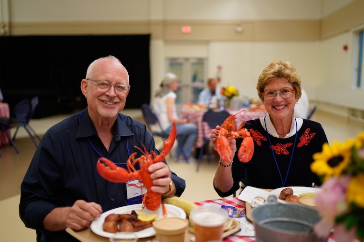 People eating at the lobster bake