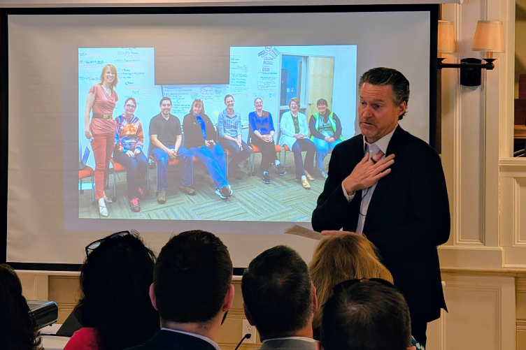 Rod Harl, chairman of Alene Candles, speaks at a recent CEO Speaker Series meeting at the Three Chimneys Inn in Durham.