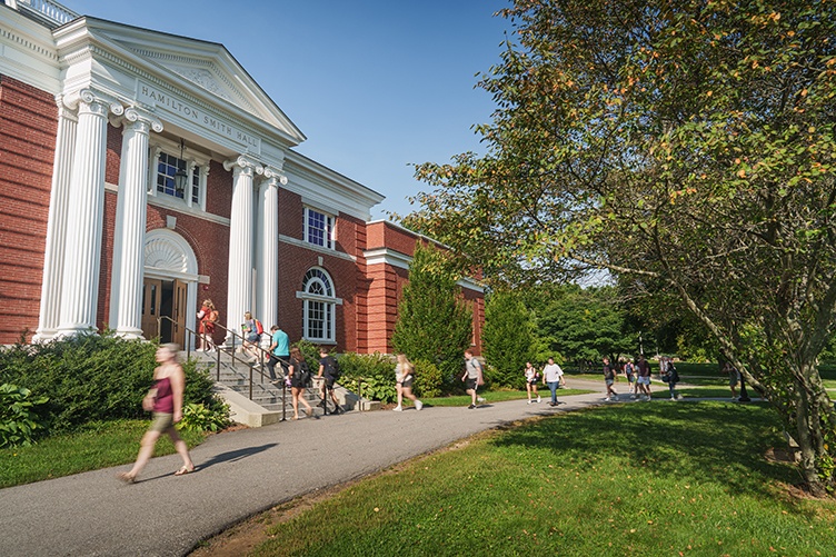 Students walk by the exterior of Hamilton Smith Hall