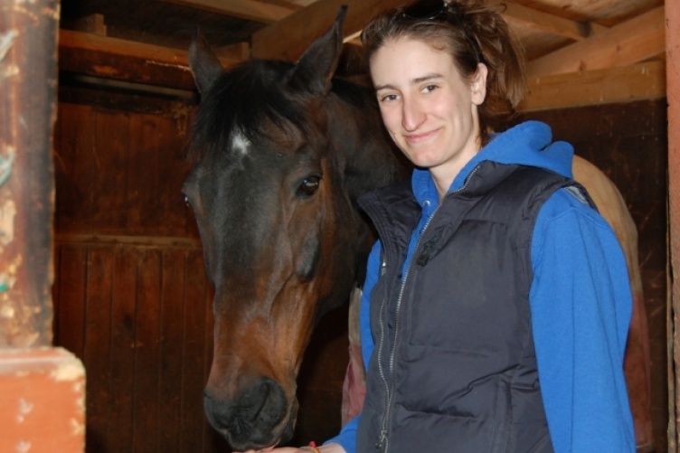 Linsey Phelan '15 with Icing on the Cake, one of her favorite horses, at the UNH horse barns