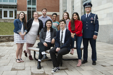 group photo of nine student ambassadors outside academic building
