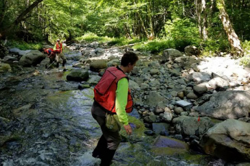 Chad Hammer and team survey river banks.