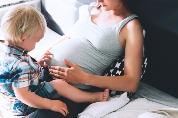 pregnant mother with child