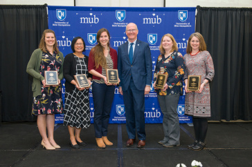 Winners of the 2019 staff excellence awards with President James Dean