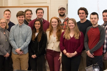 UNH students pose in classroom