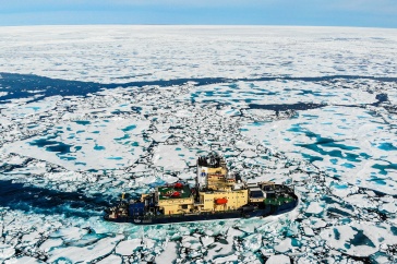 Icebreaker cuts through sea ice.