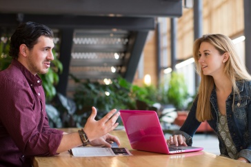 UNH online MBA students studying together
