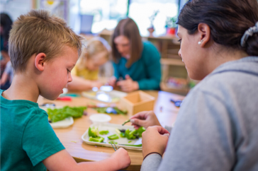 Teachers work with students at the Child Study and Development Center at UNH