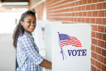 Young girl voting in America