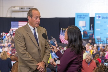 Andy Smith talking with reporter