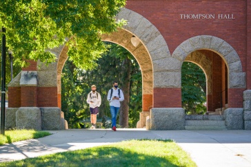 Students walking through T Hall arch