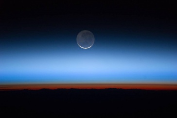 Evening sky with crescent moon.