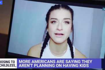 A woman speaking on a zoom call about the drop in birth rate.